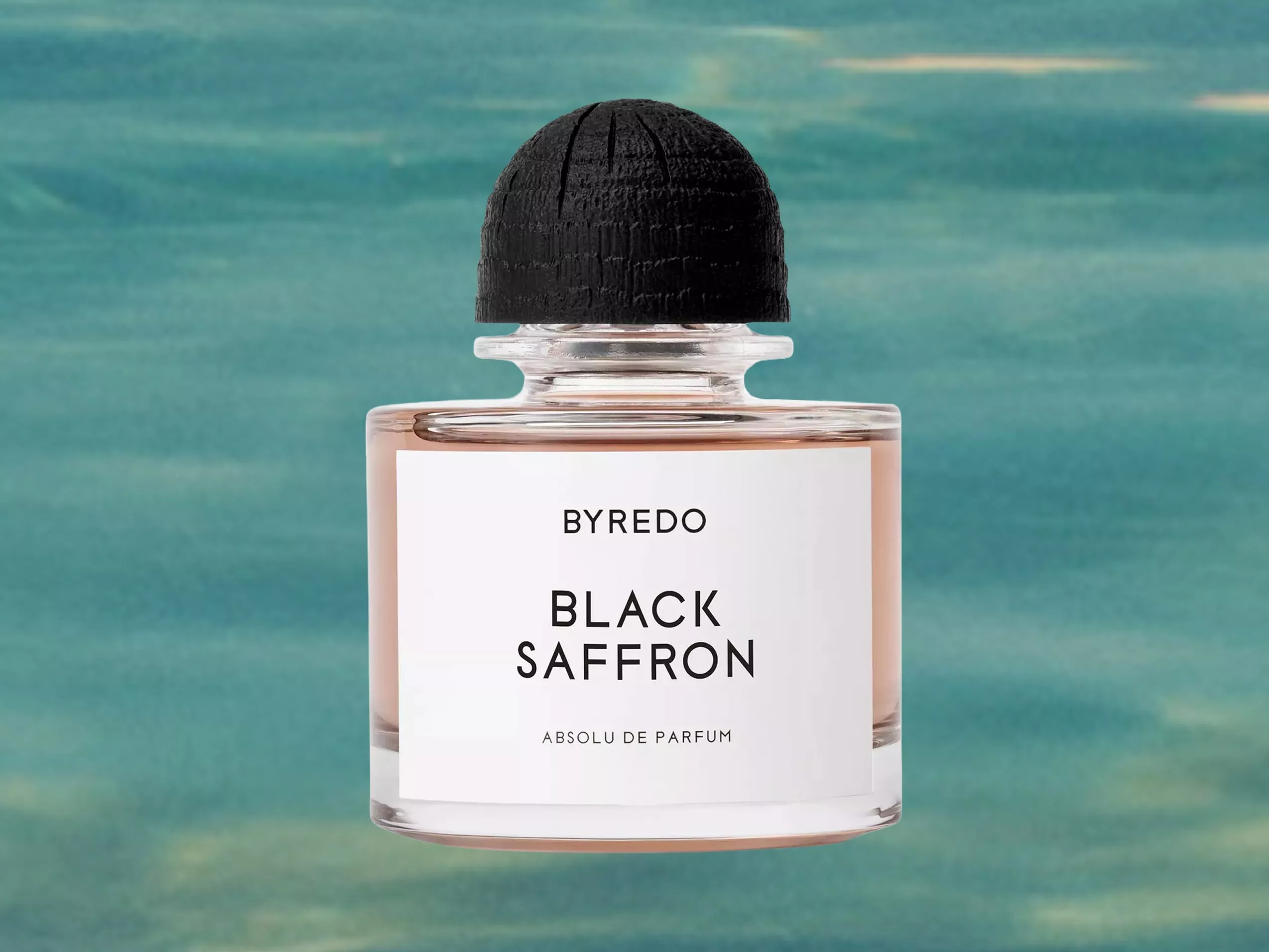 Byredo Black Saffron Absolu de Parfum bottle with black cap on sea background