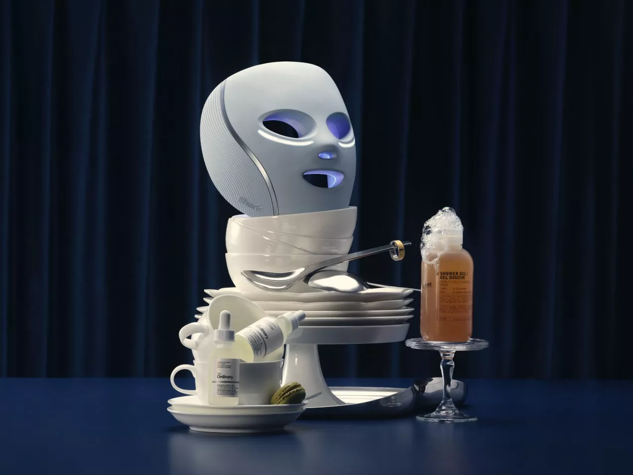 a shark mask in a bowl and other beauty products stacked in crockery