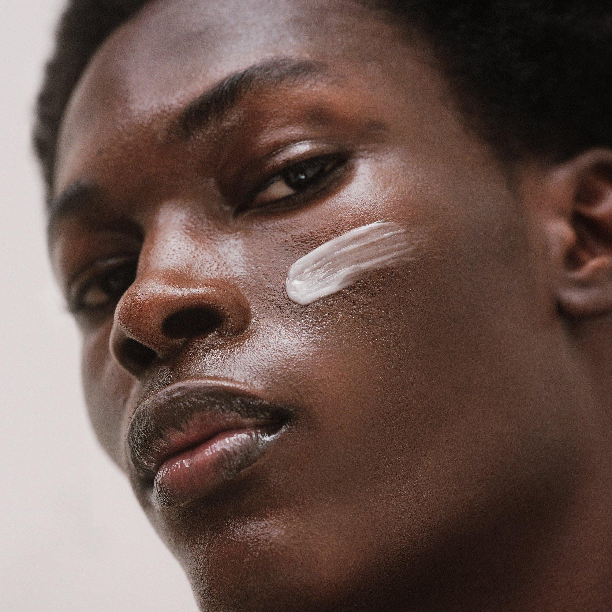 Image of a man with cream on his face