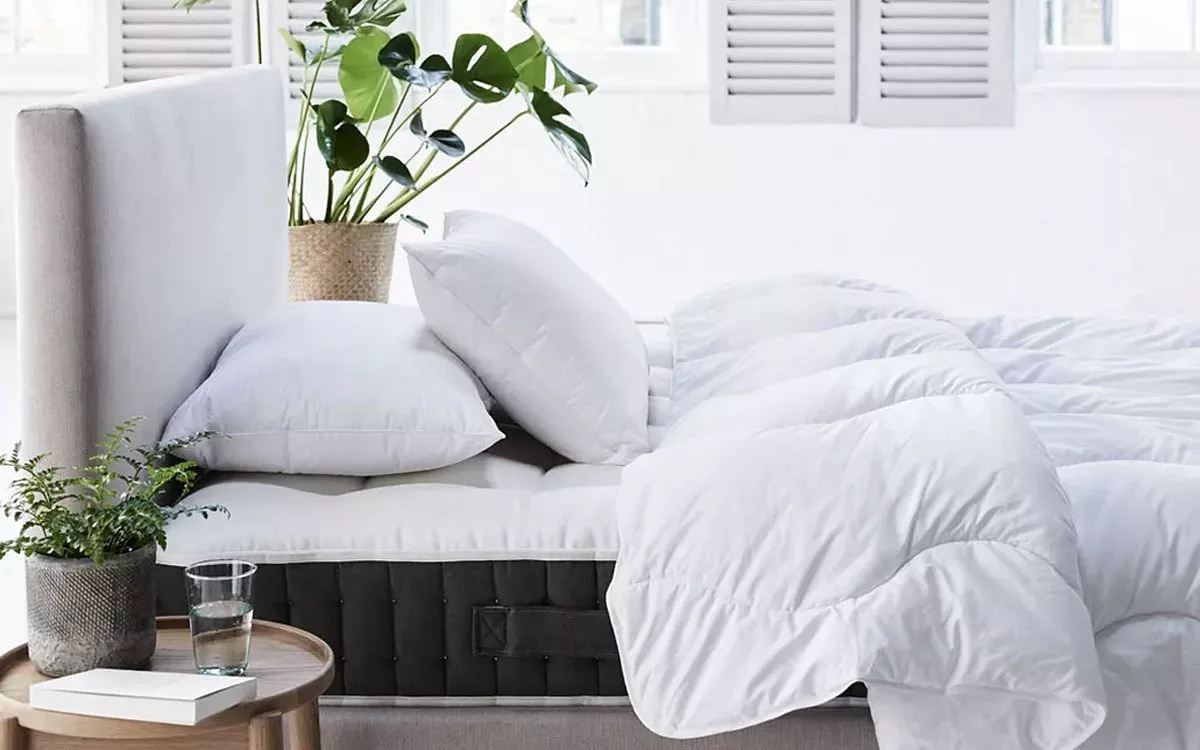 Bed with pillow and duvet