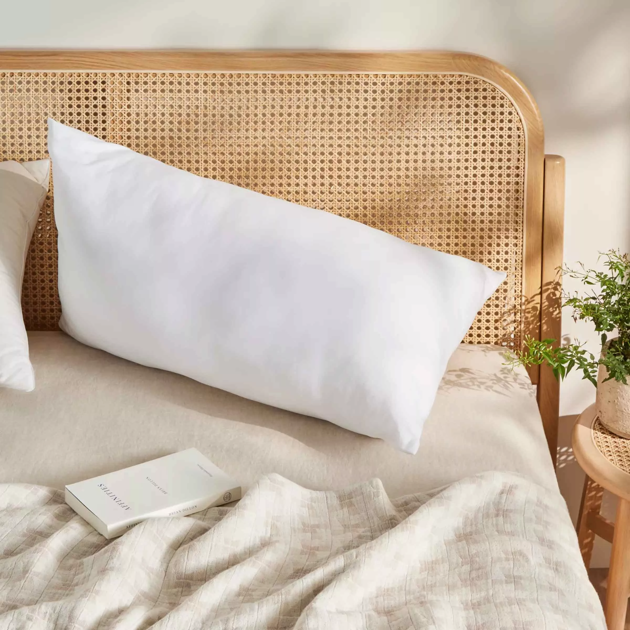 Reading pillow which triangular shaped on a bed