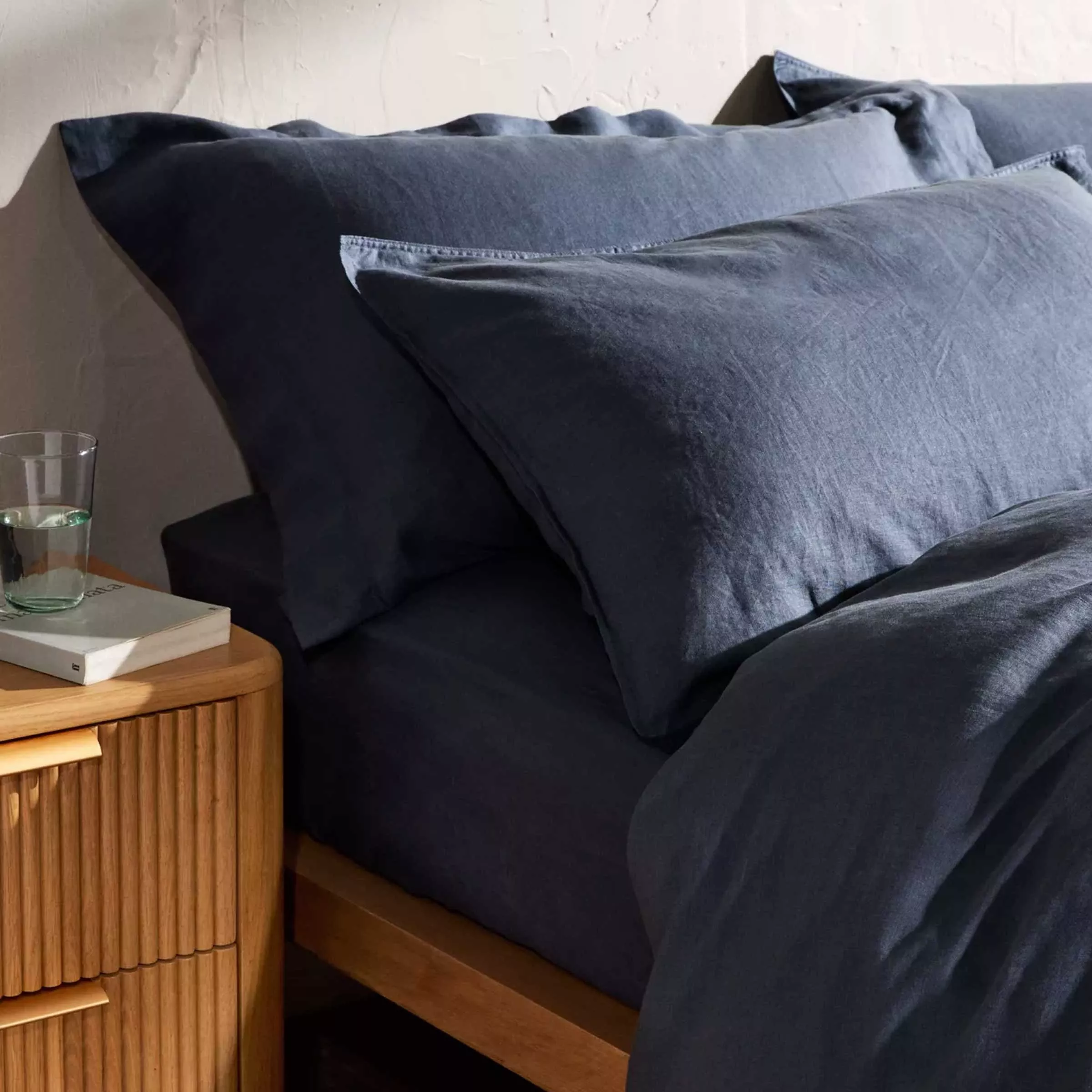 Bed with navy bedding 