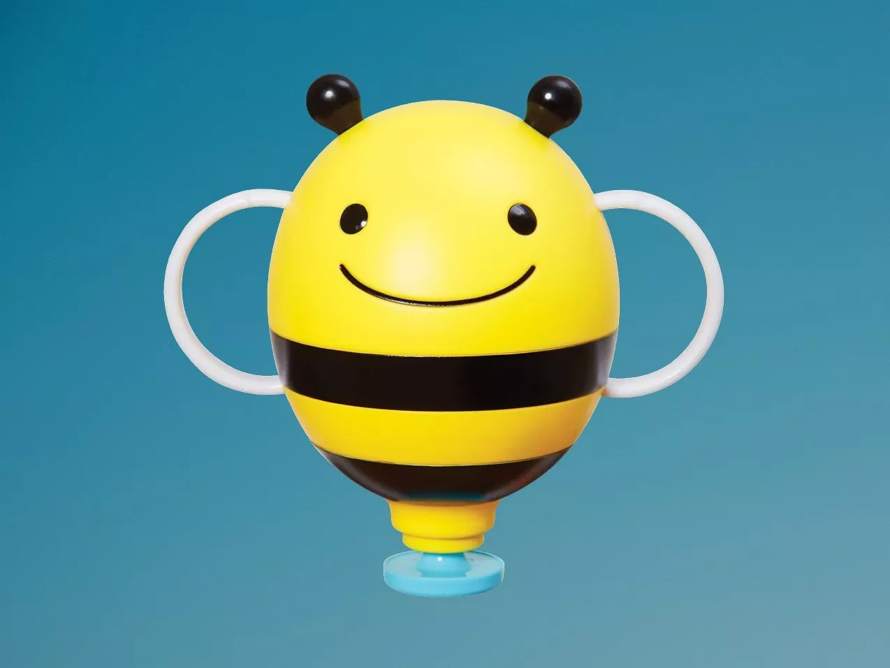 Smiling bee-shaped baby cup with side handles and blue base, yellow and black design on white background
