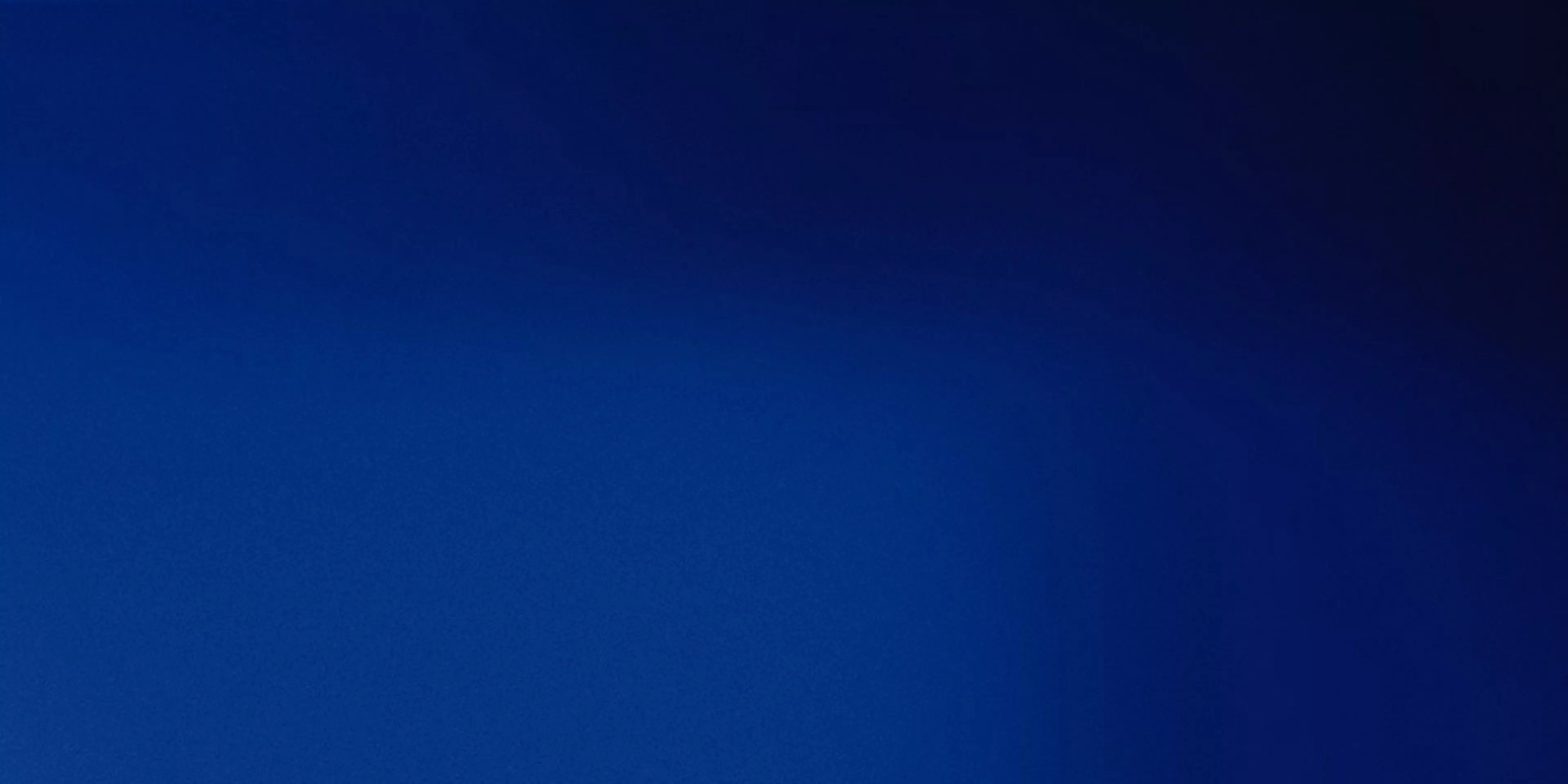 Abstract deep blue gradient background with soft blurred texture