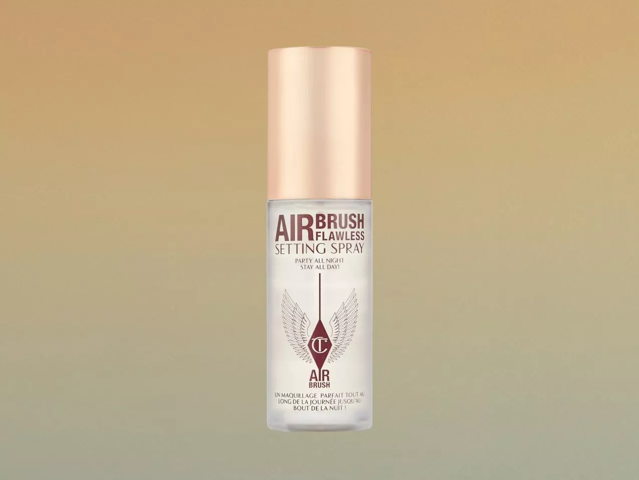 Charlotte Tilbury Airbrush Flawless Setting Spray bottle with rose gold cap on beige background