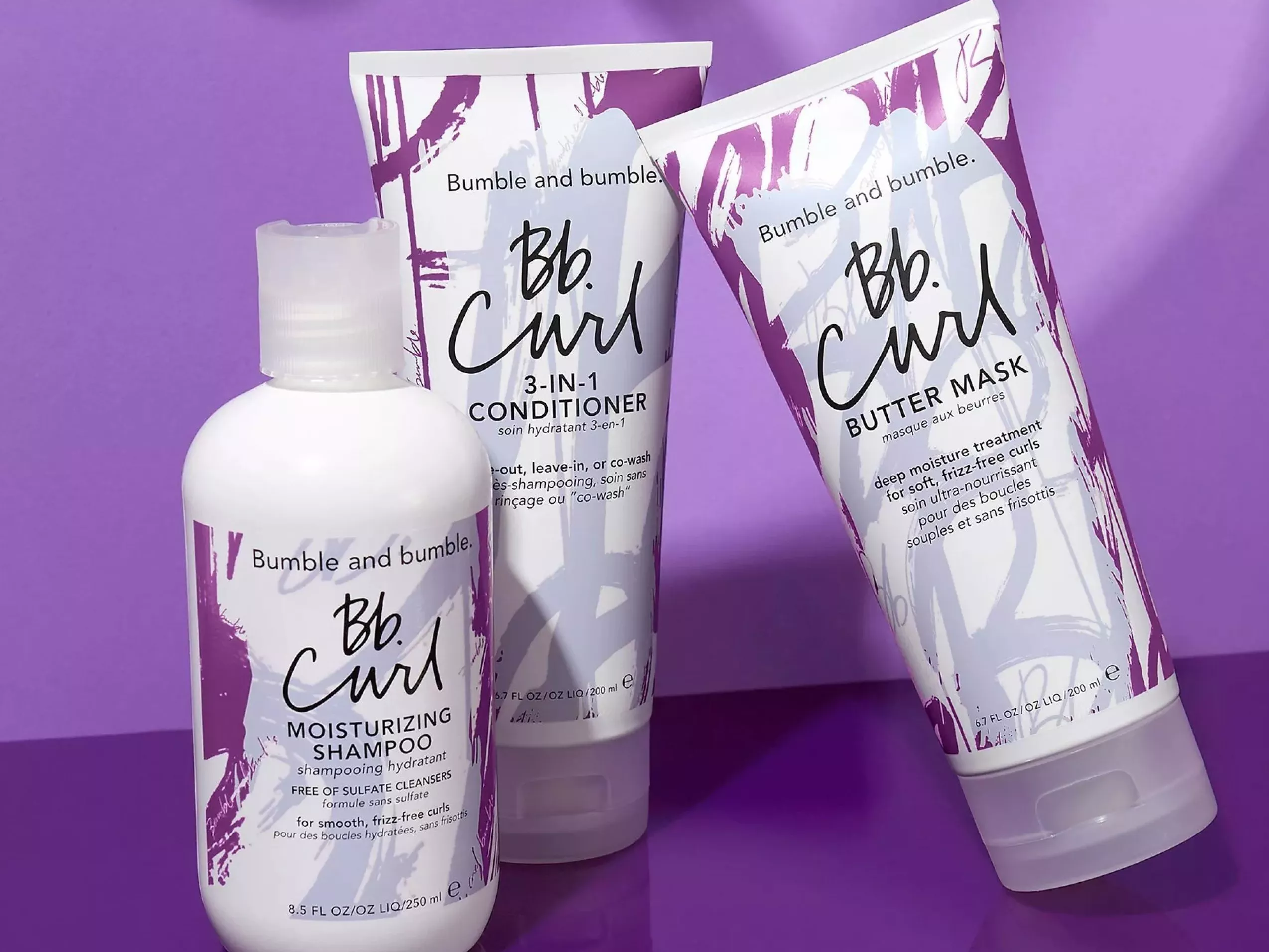 Bumble and bumble Bb. Curl moisturising shampoo, 3-in-1 conditioner and butter mask on purple background