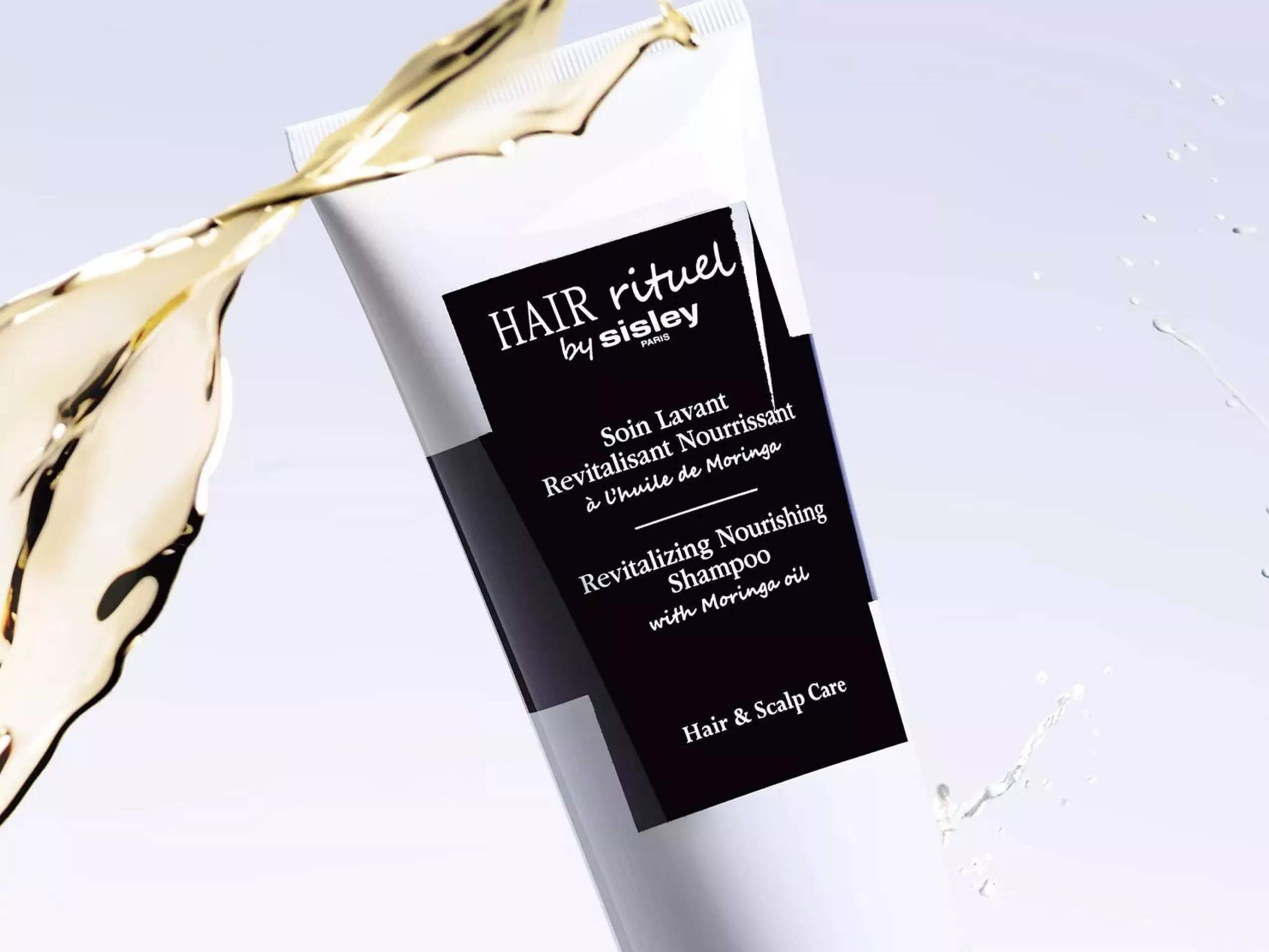 Sisley Hair Rituel Revitalising Nourishing Shampoo with moringa oil, bottle with oil splash on white background
