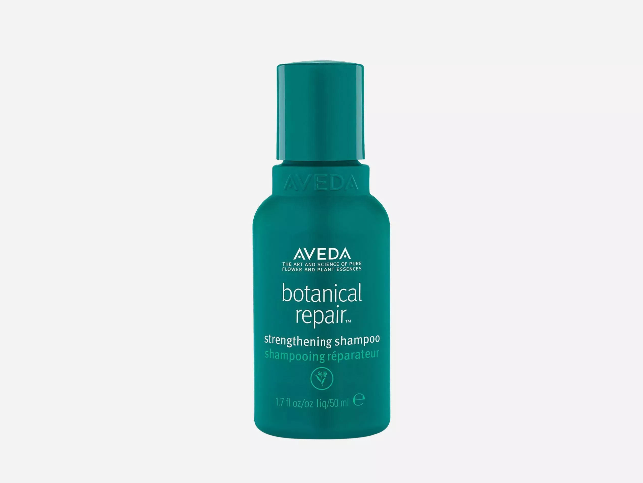 Aveda Botanical Repair strengthening shampoo bottle in teal, hair repair and strengthening product on white background