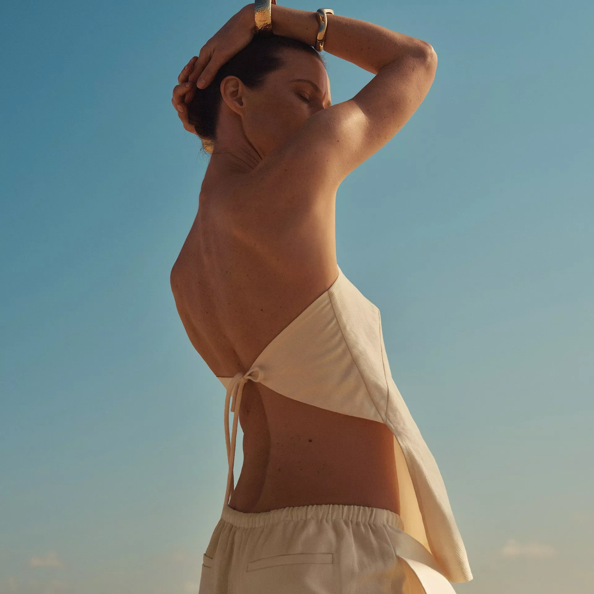 Ninja countertop air fryer oven with glass bowl roasting chicken and veg, plus extra tray with salmon and broccoli