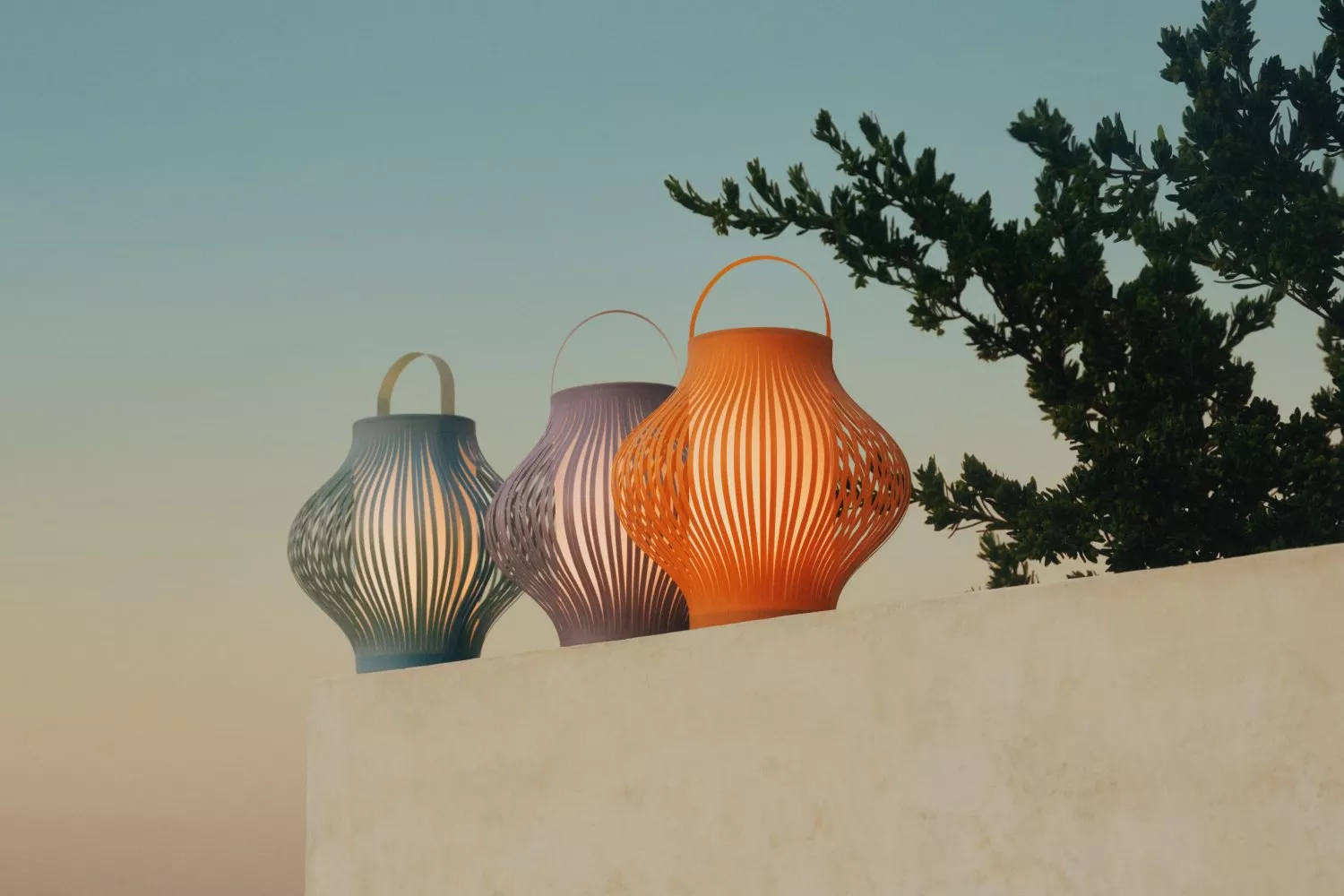 Three colourful outdoor lanterns on a white wall at dusk, modern garden lighting with tree silhouette.