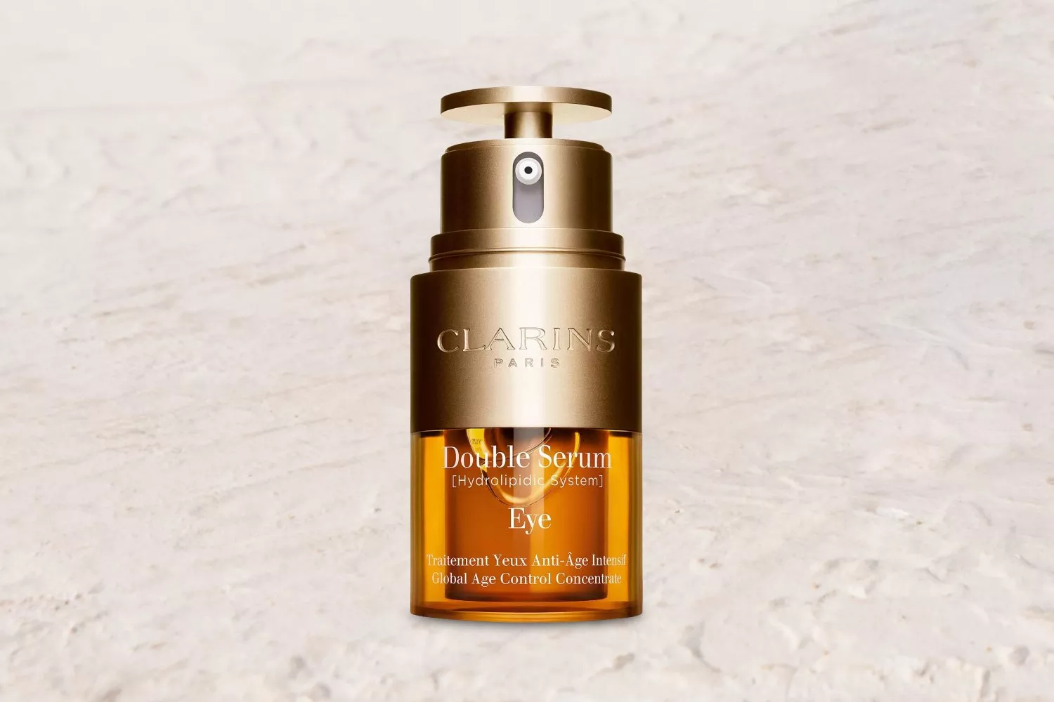 Clarins Double Serum Eye bottle with a coastal background, showcasing luxury skincare amidst nature.