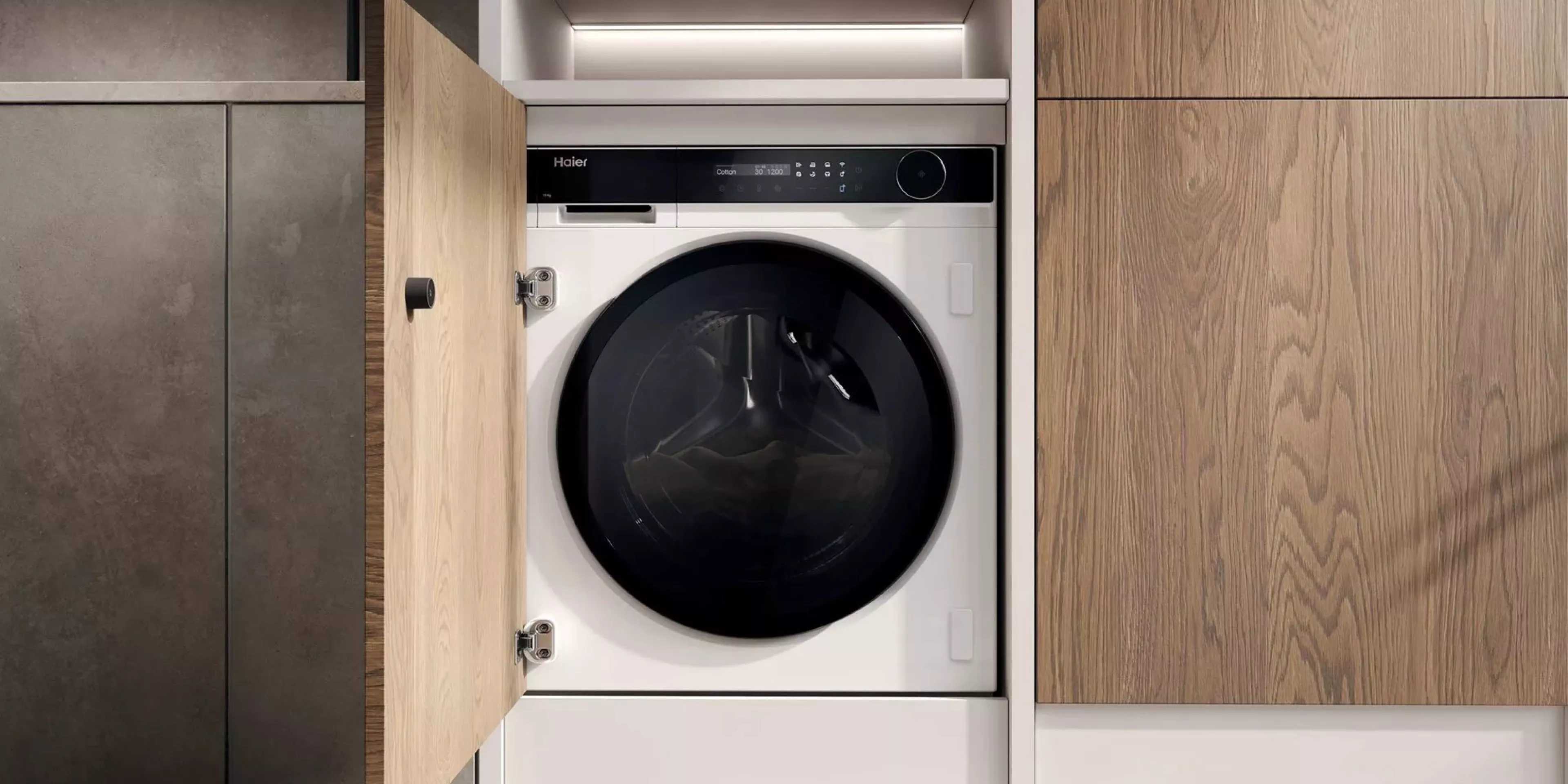 Built-in front-loading washing machine in modern utility cupboard with wood doors and LED lighting