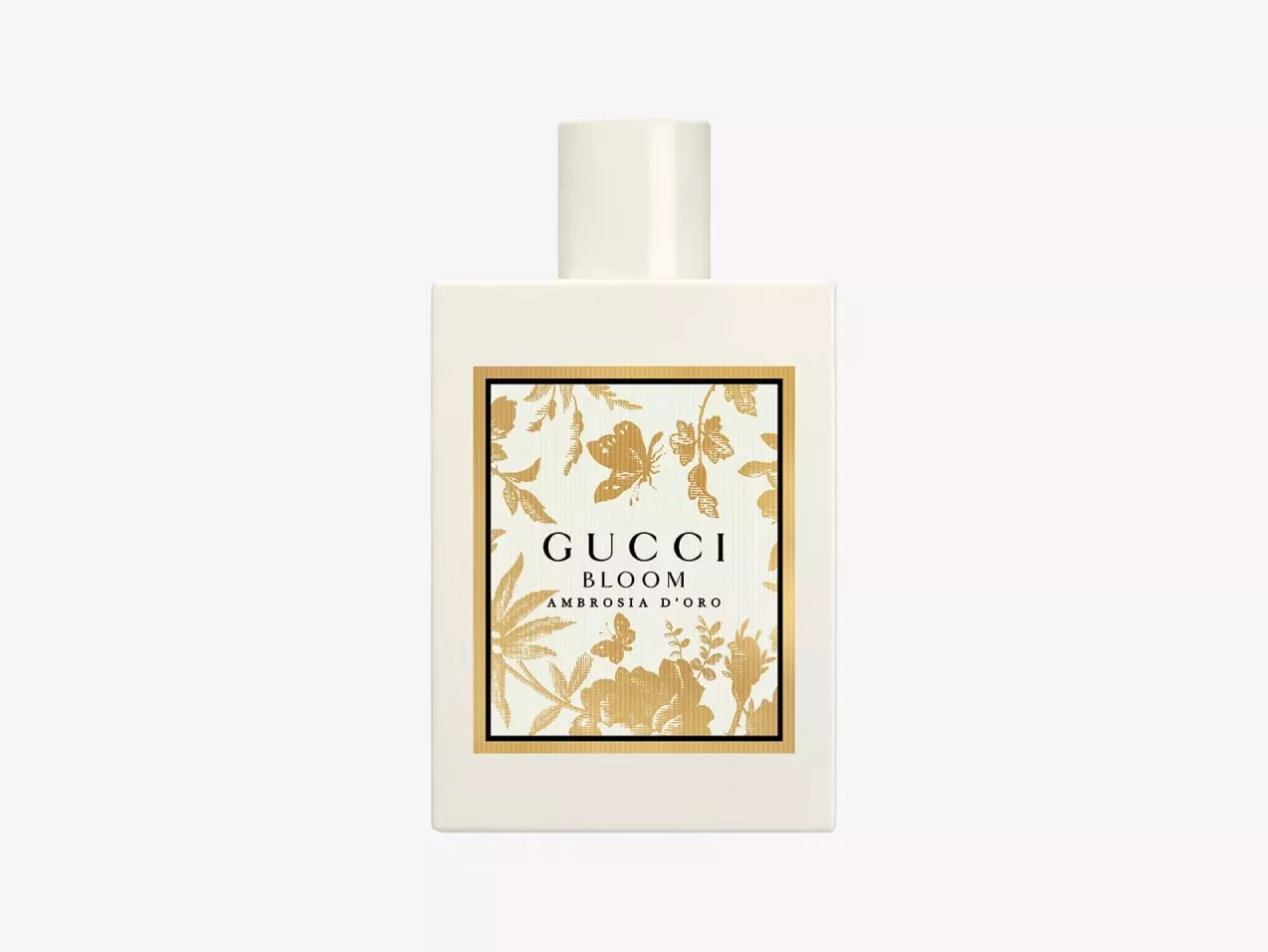 Gucci Bloom Ambrosia d’Oro perfume bottle in white with gold floral label, luxury fragrance product shot