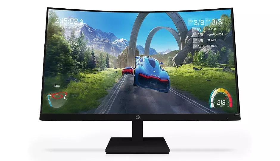 Curved gaming monitor displaying a vibrant racing game with futuristic cars and mountainous scenery.
