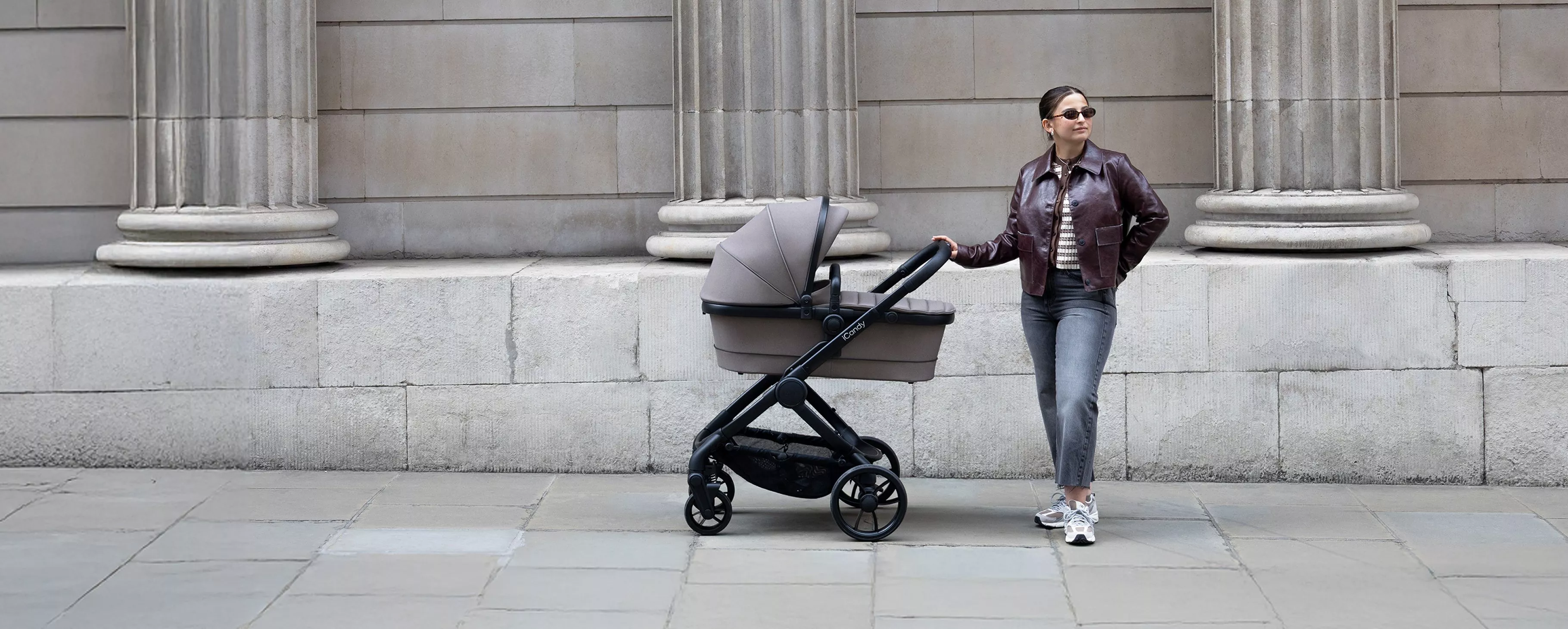 Woman standing next to pram