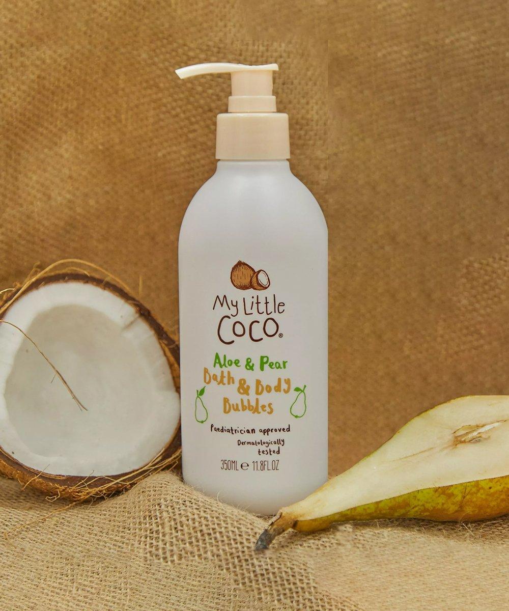 my little coco pregnancy bag on a beige background, with a coconut