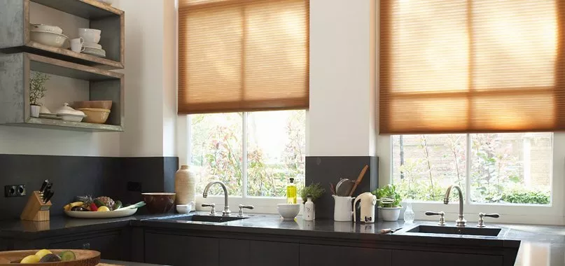Beige blinds with wooden cabinet and clothes rail 
