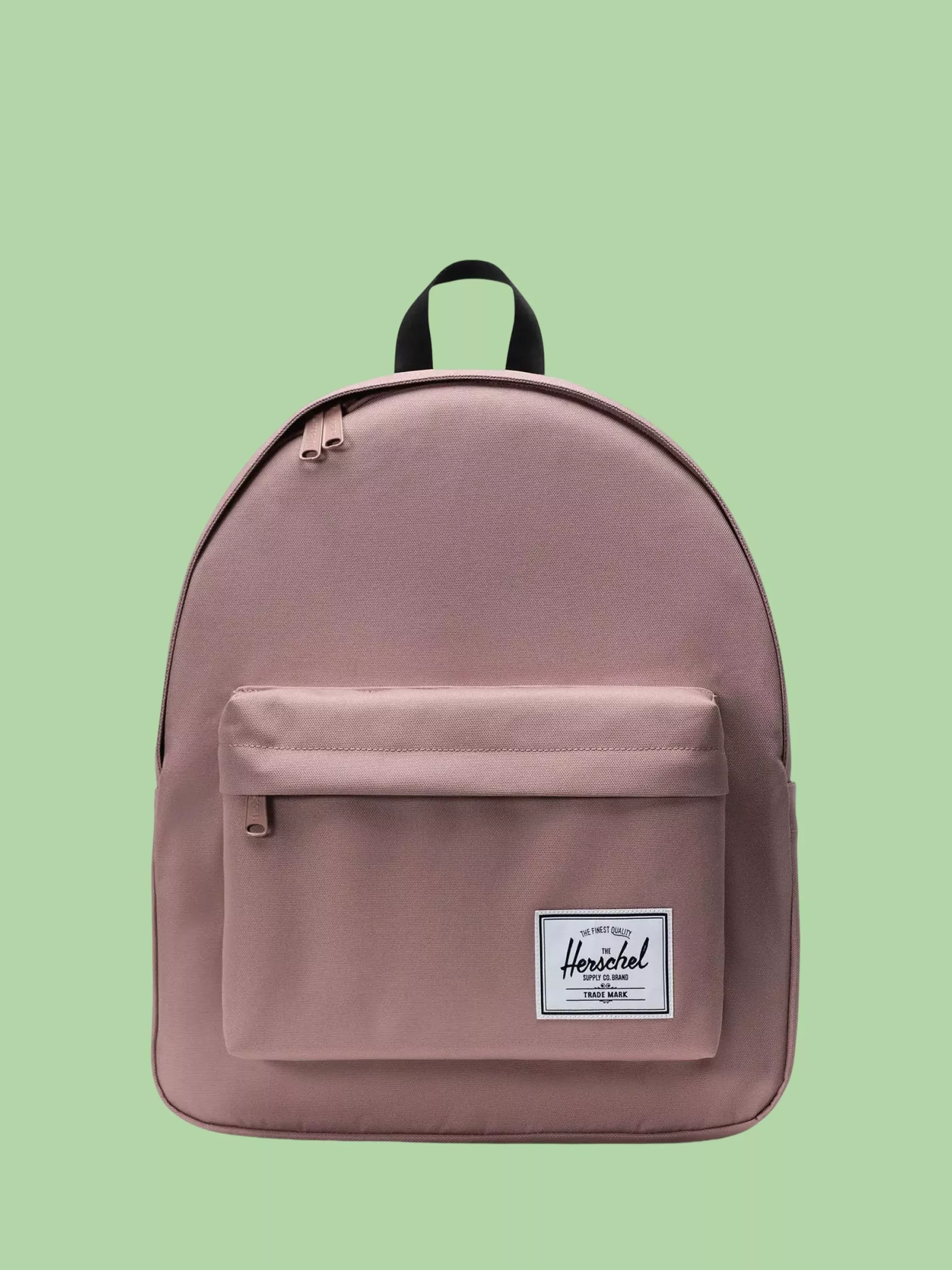 Herschel Supply Co. Kids' Heritage Backpack on a green background