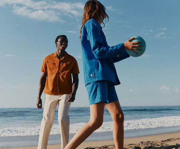  two people playing on a beach