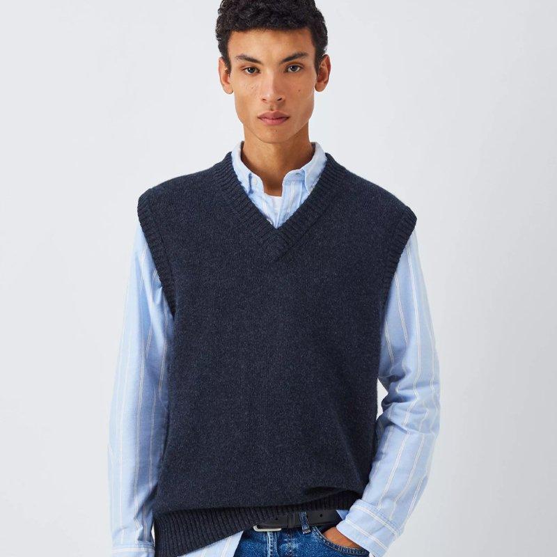 Male model wearing a navy cashmere crew neck sweater vest