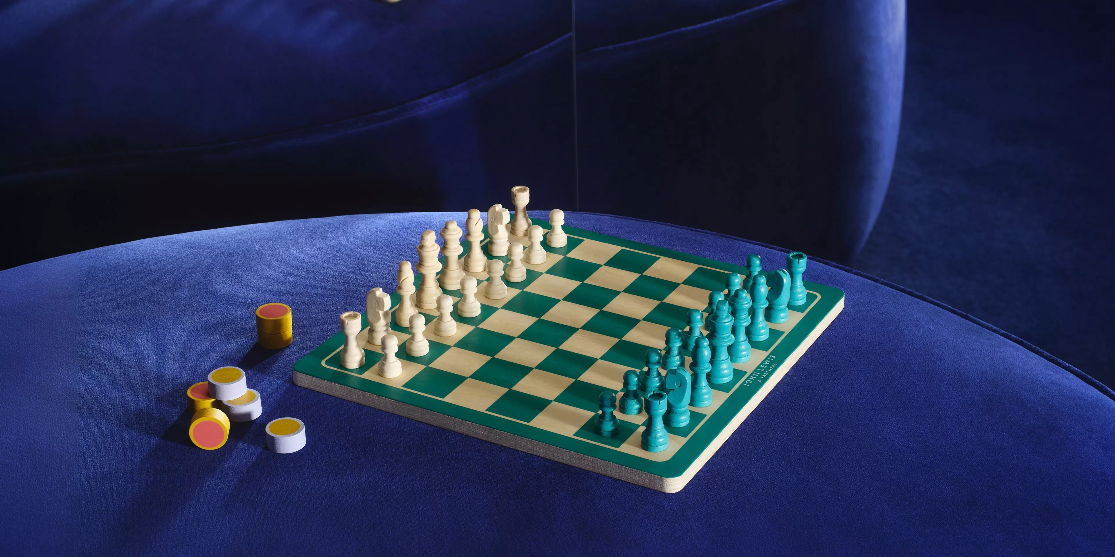 chess board on a blue velvet chair