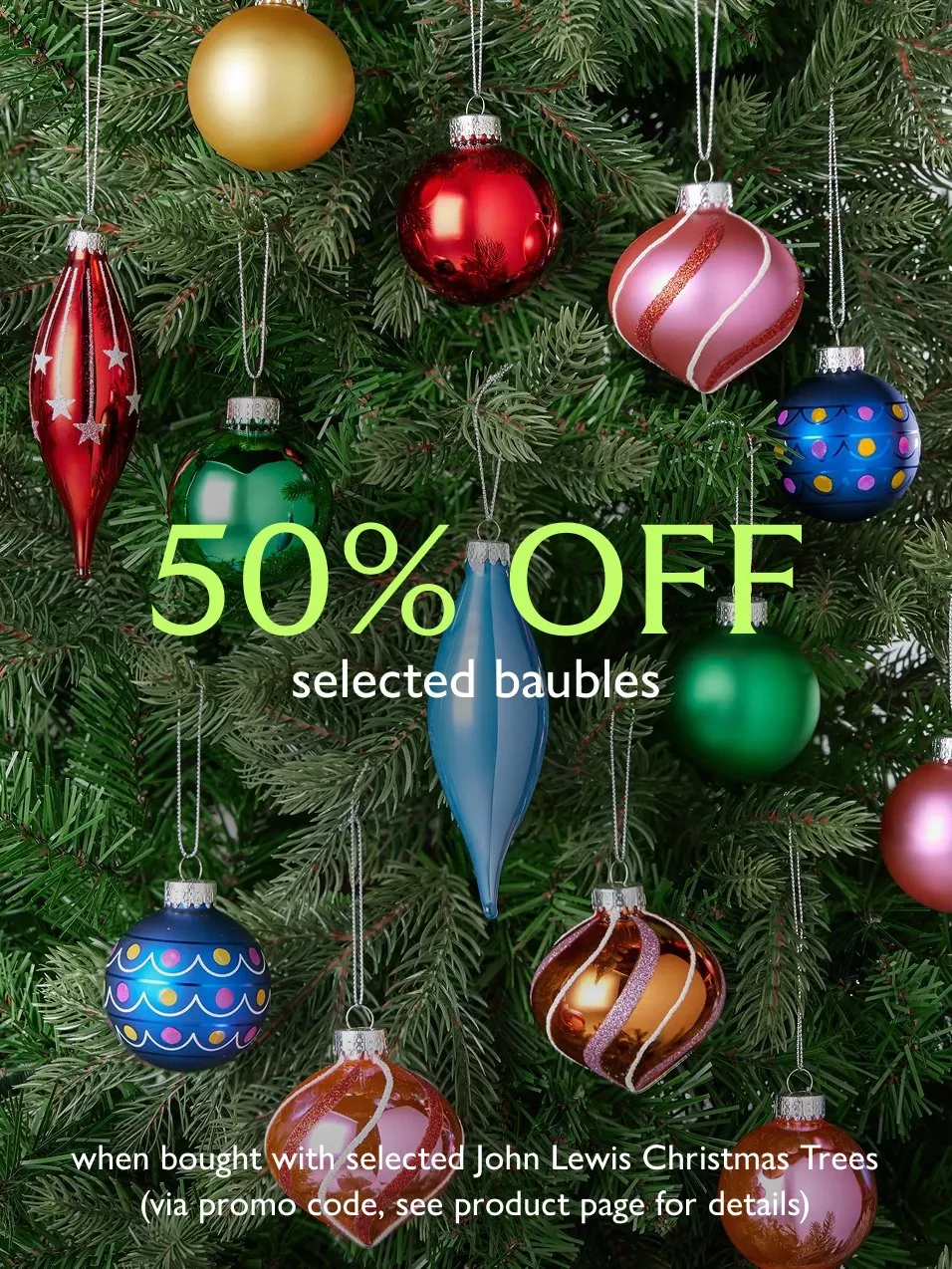 Christmas tree with colourful baubles and “50% off selected baubles” promotional offer text on branches