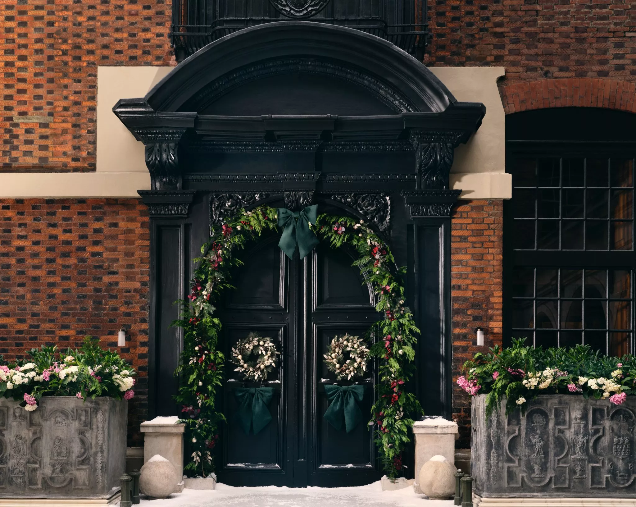 Front door decorated with a Christmas wreath