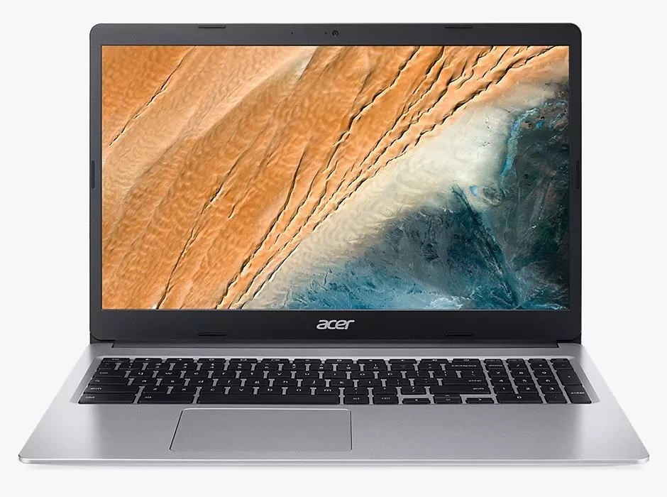 A sleek Acer laptop with a silver body, displaying a vibrant desert-themed wallpaper on its screen.