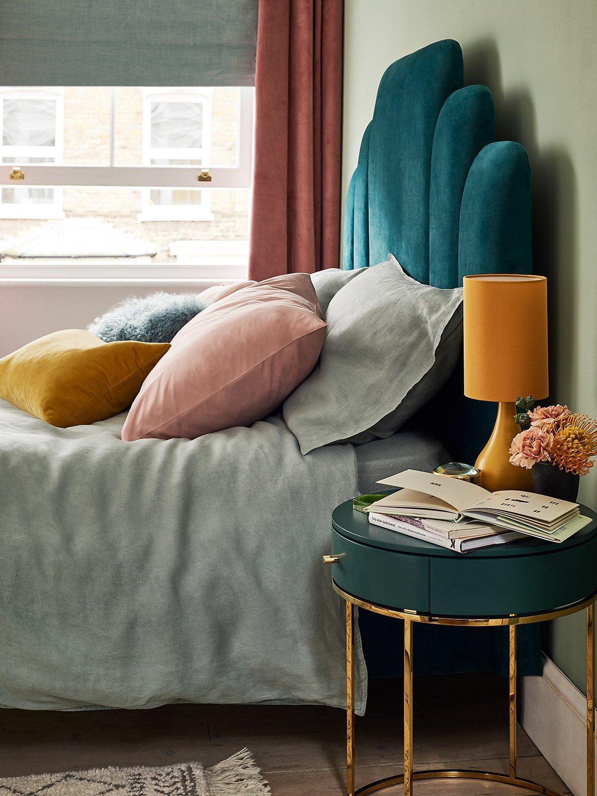 Contemporary Luxe - bed with blue head board. side table and lamp