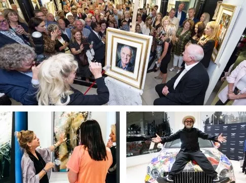 Crowded art gallery event with live portrait painting on easel, spectators watching and photographing the artwork.