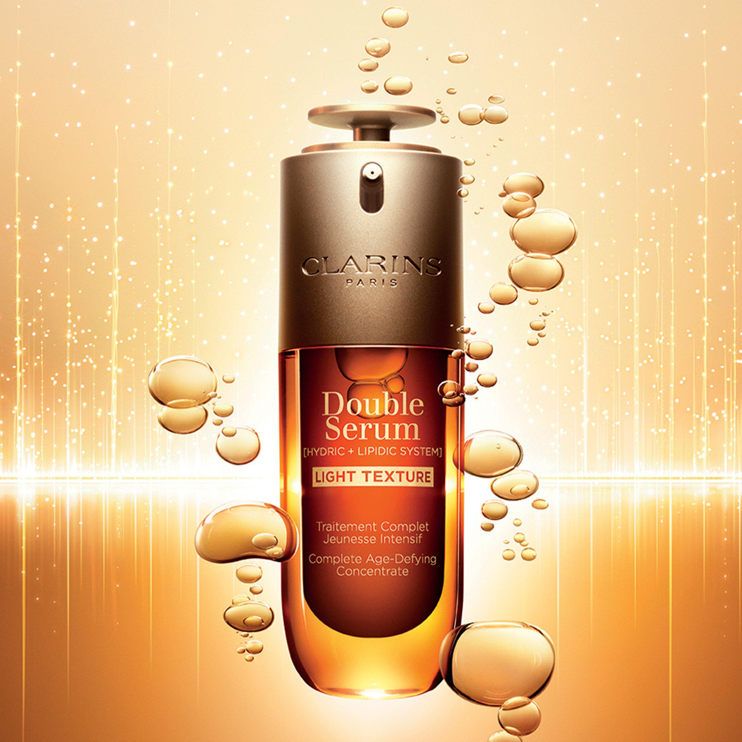 clarins serum with lighting effect and bubbles in background