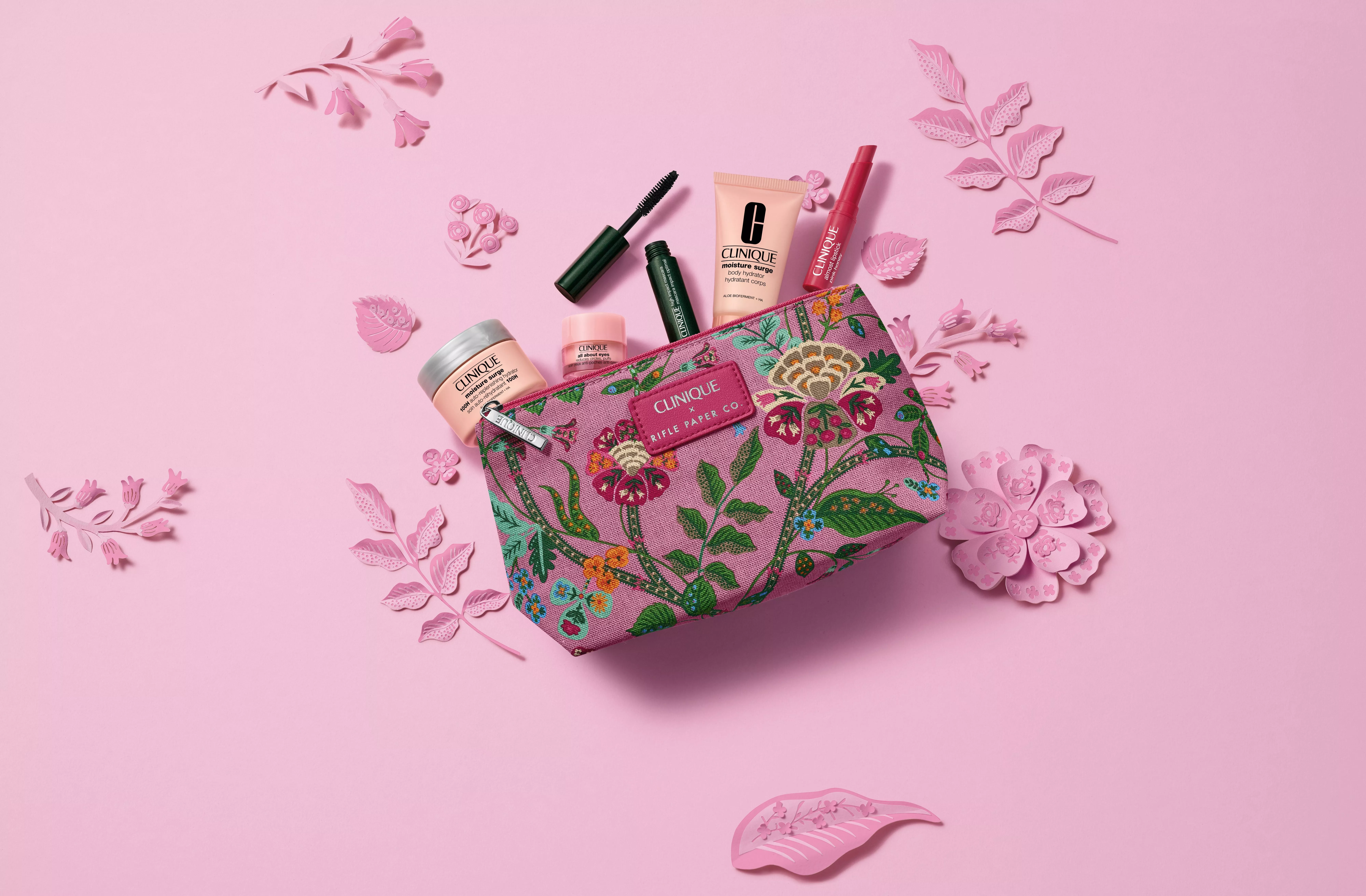 Clinique make-up and skincare gift set with floral pouch, mascara, cream and lip colour on pink background