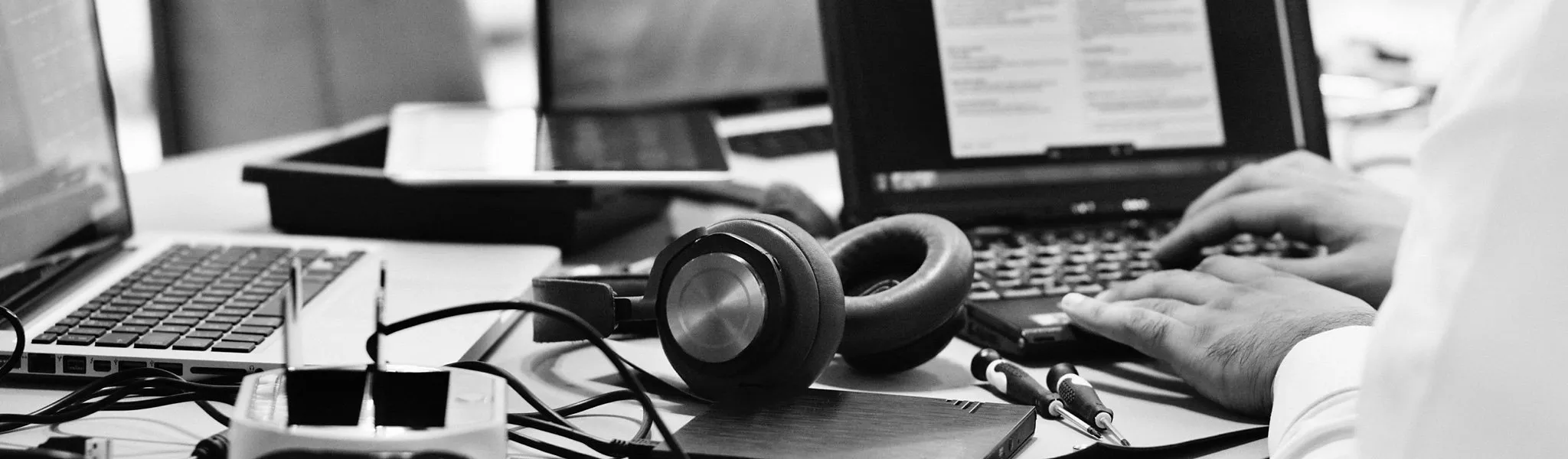 Headphones and laptops on a table