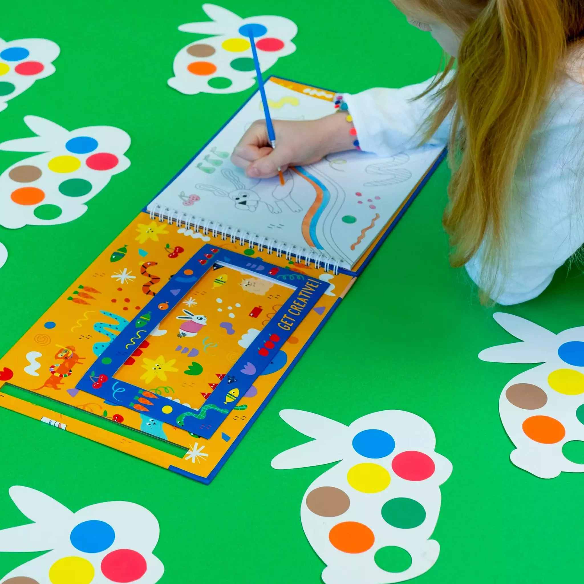 Child painting in a book 