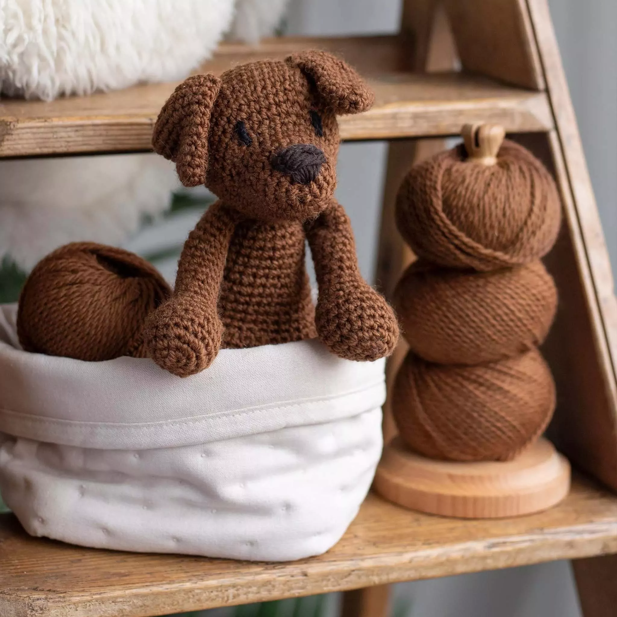 Crochet dog beside yarn 