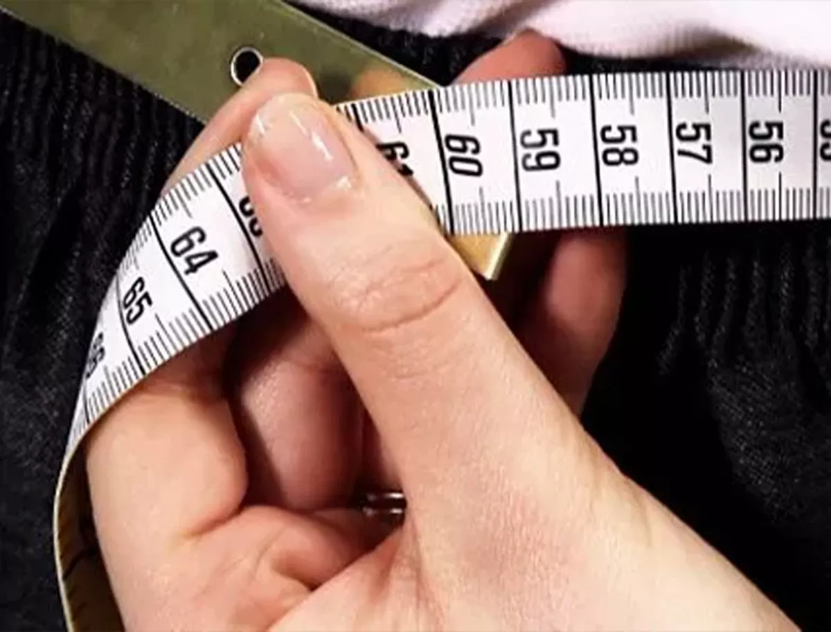 Person using a measuring tape