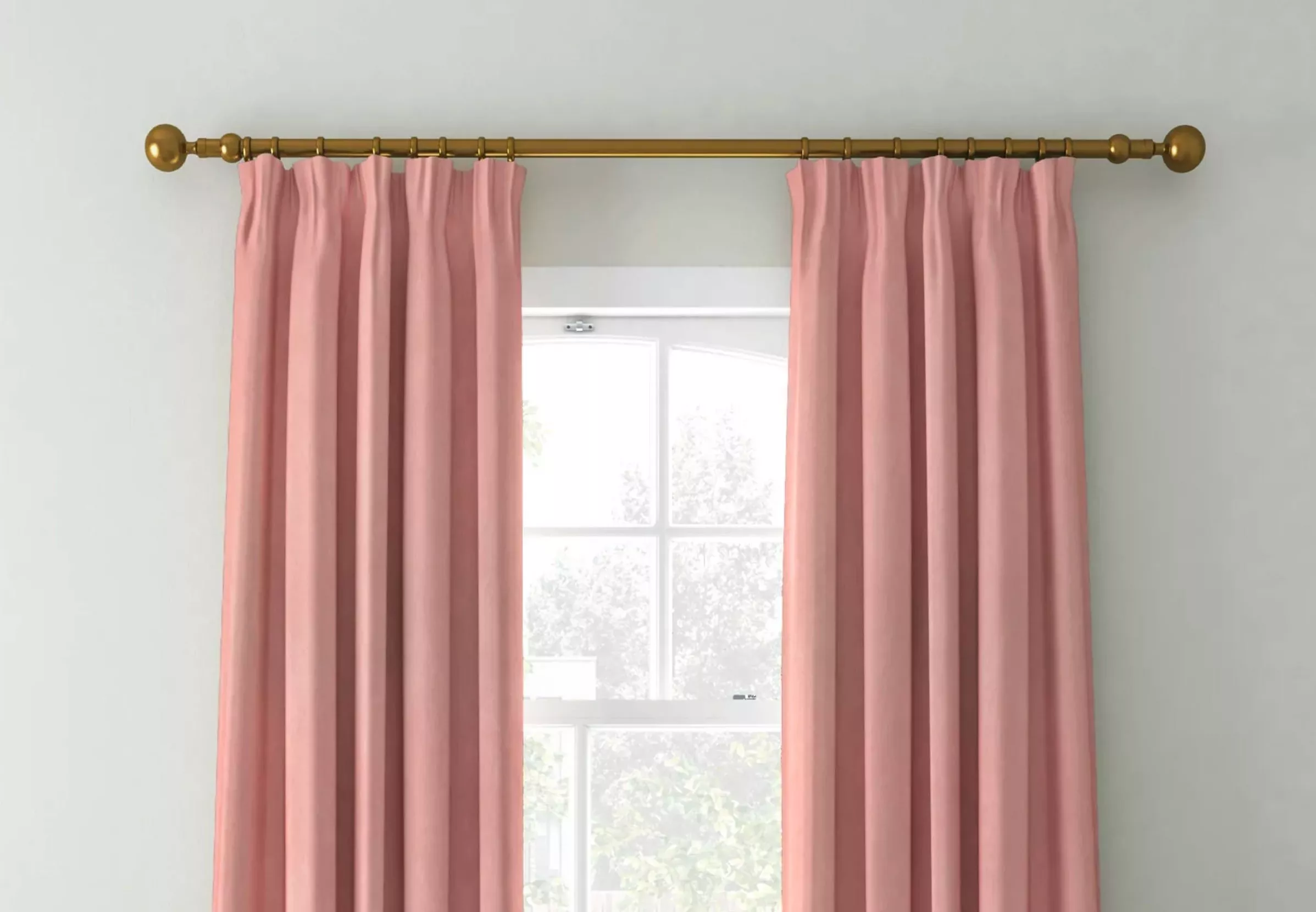 Pink curtains on a brass curtain rail 