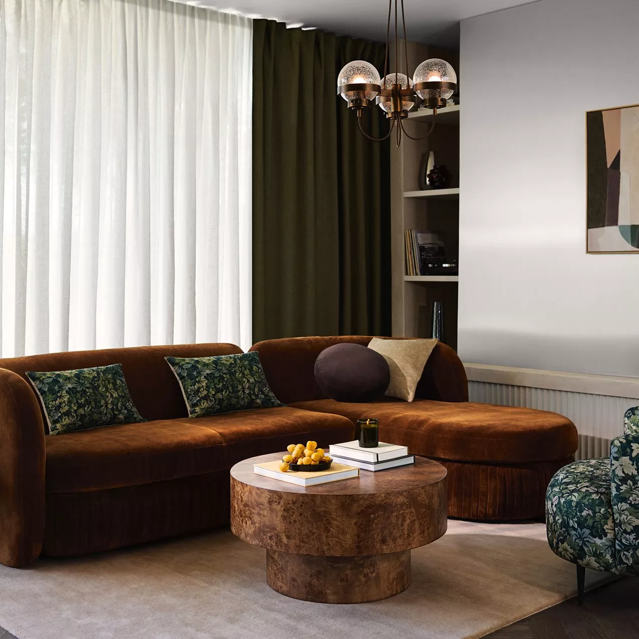 A home design services person at a desk with a laptop and colour swatches