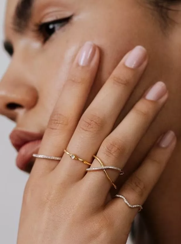 woman wearing diamond band rings