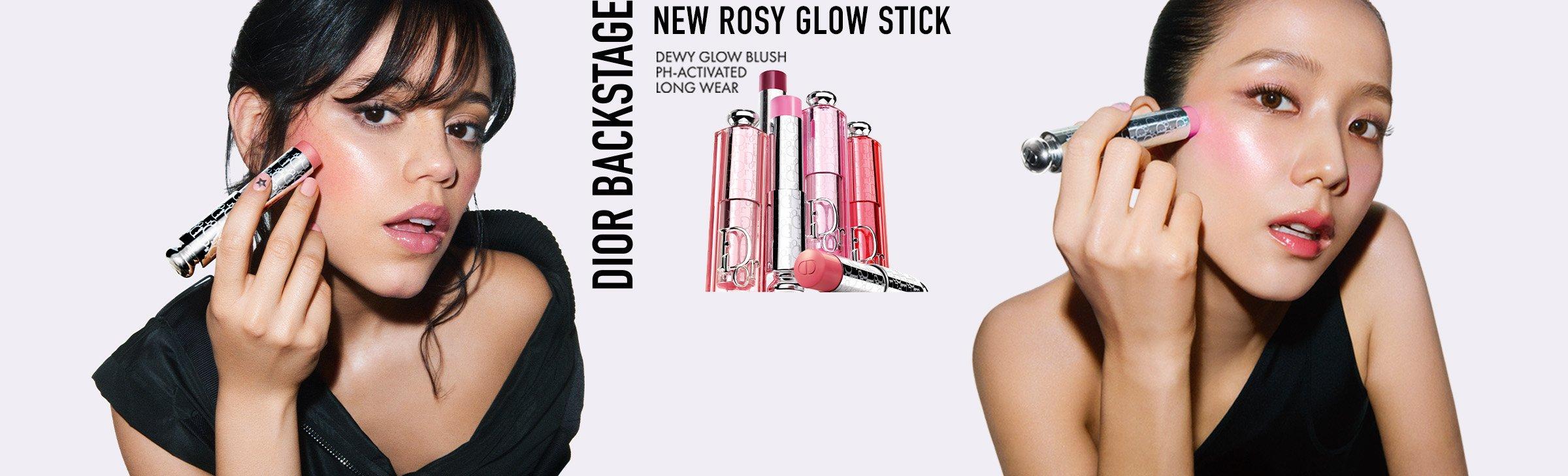 Two women applying pink blush with Dior lipstick-shaped makeup sticks, with Dior Backstage product display in the center