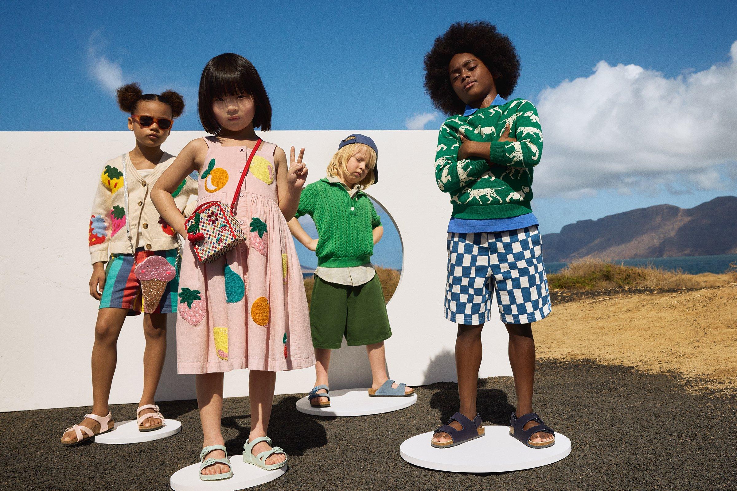 Kids wearing cool bright coloured clothing on the beach