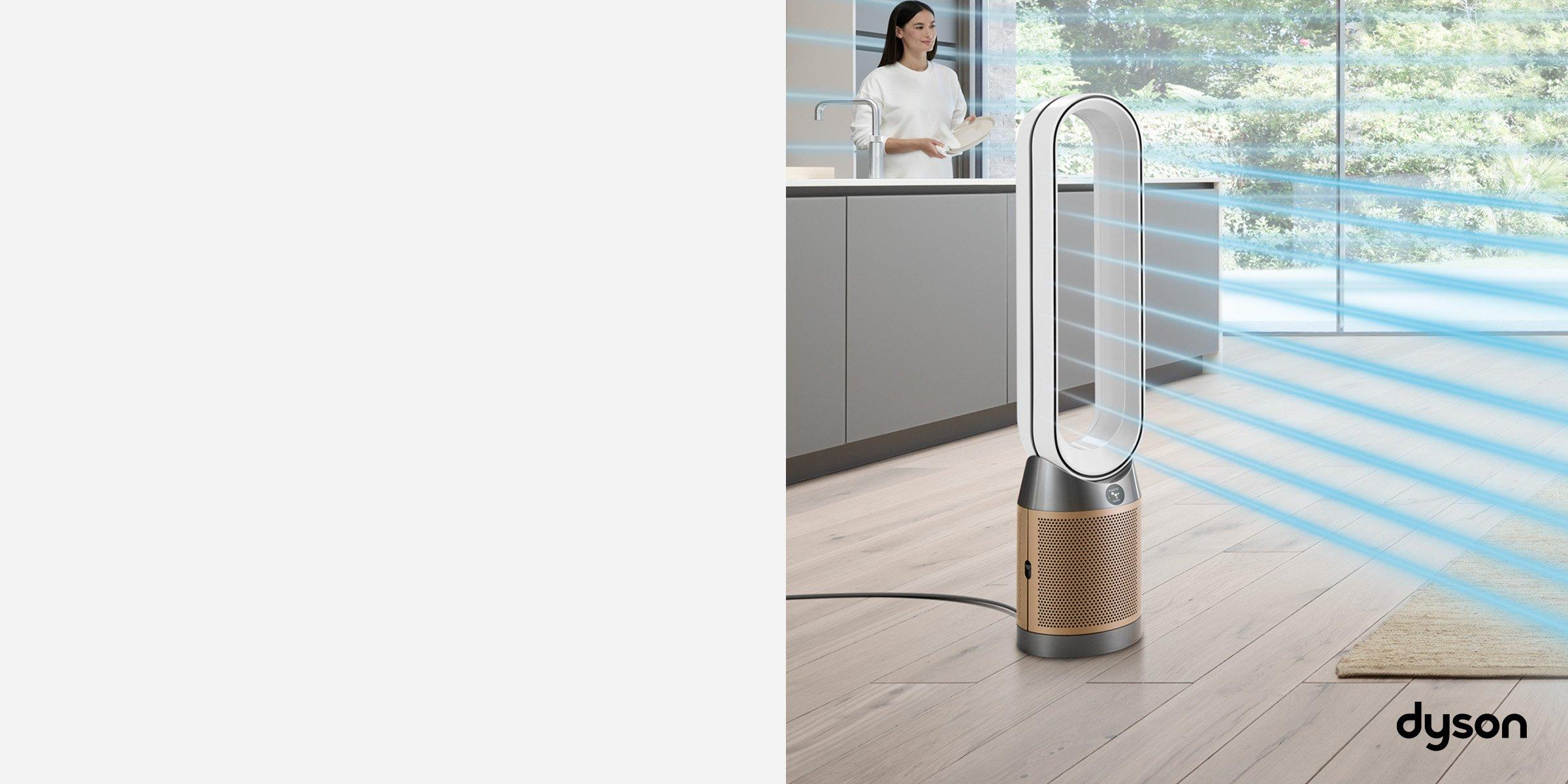 Dyson air purifier and women standing behind the kitchen counter.