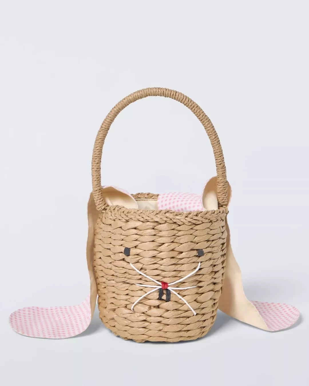 Woven basket with handle shaped like a rabbit face, featuring pink gingham-lined ears and whiskers.