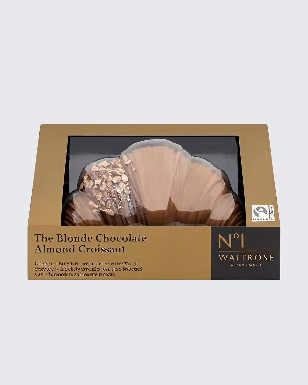 Waitrose Blonde Chocolate Almond Croissant in gold packaging, showcasing Fairtrade logo and visible croissant.
