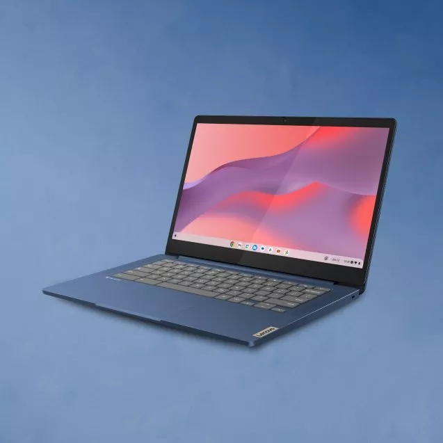 Sleek blue laptop with a vivid screen displaying red and purple hues, set against a soft blue background.