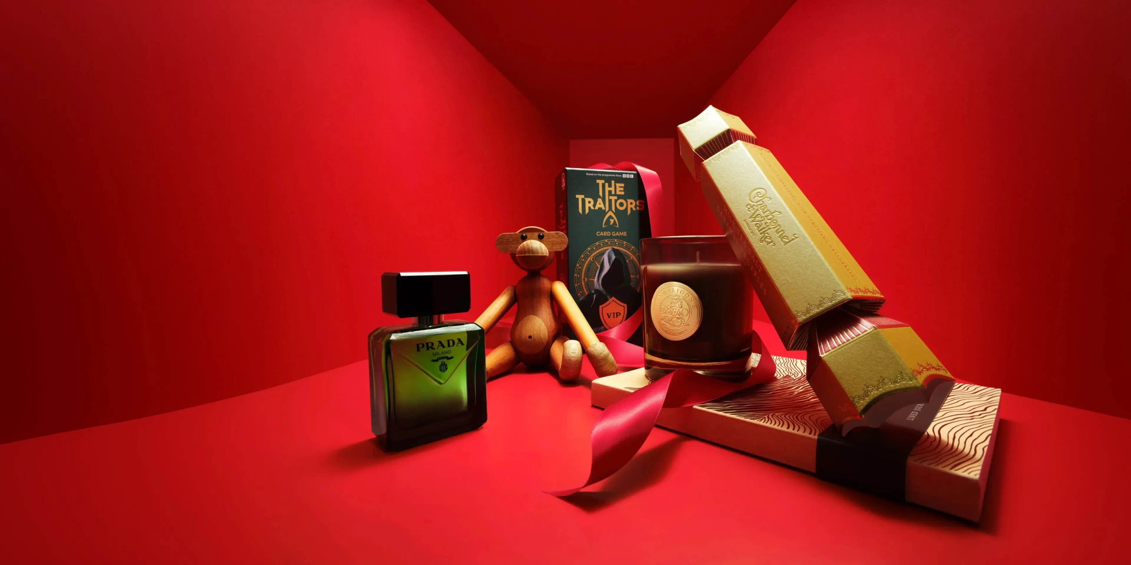 Colourful collectible display: LEGO Darth Vader figure, lava lamp, tapes and red bag on blue backdrop