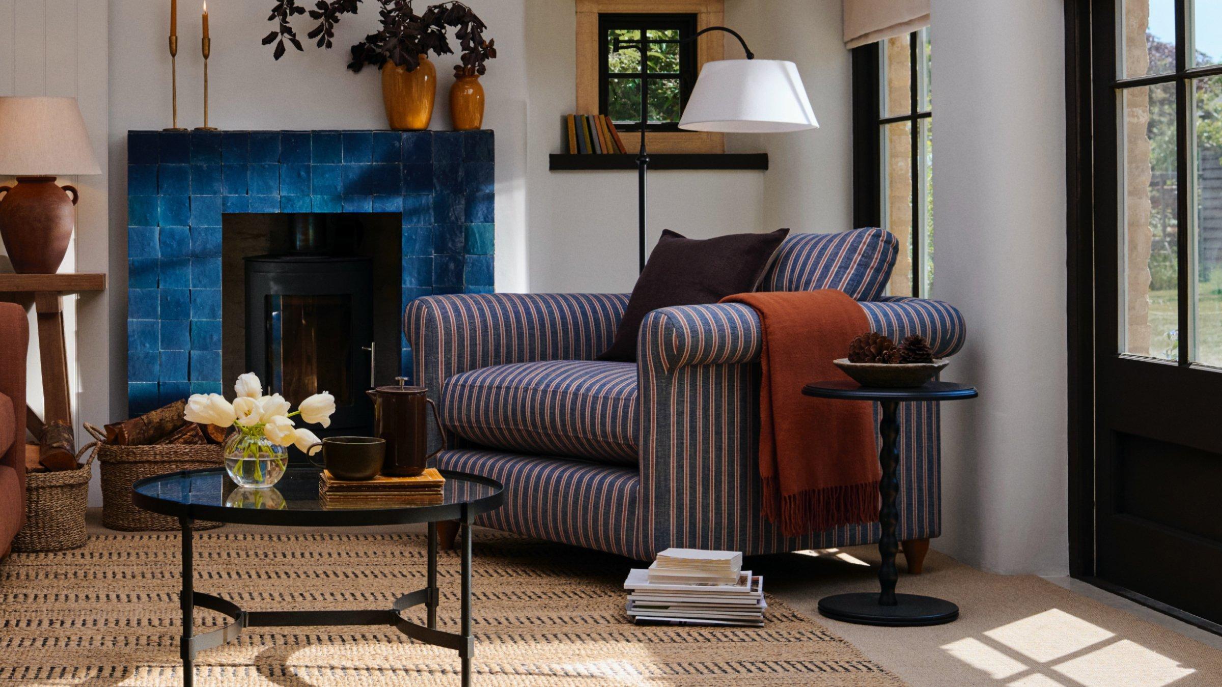 lifestyle shot of a matress on a bed with cusions on it set in modern neautral coloured room