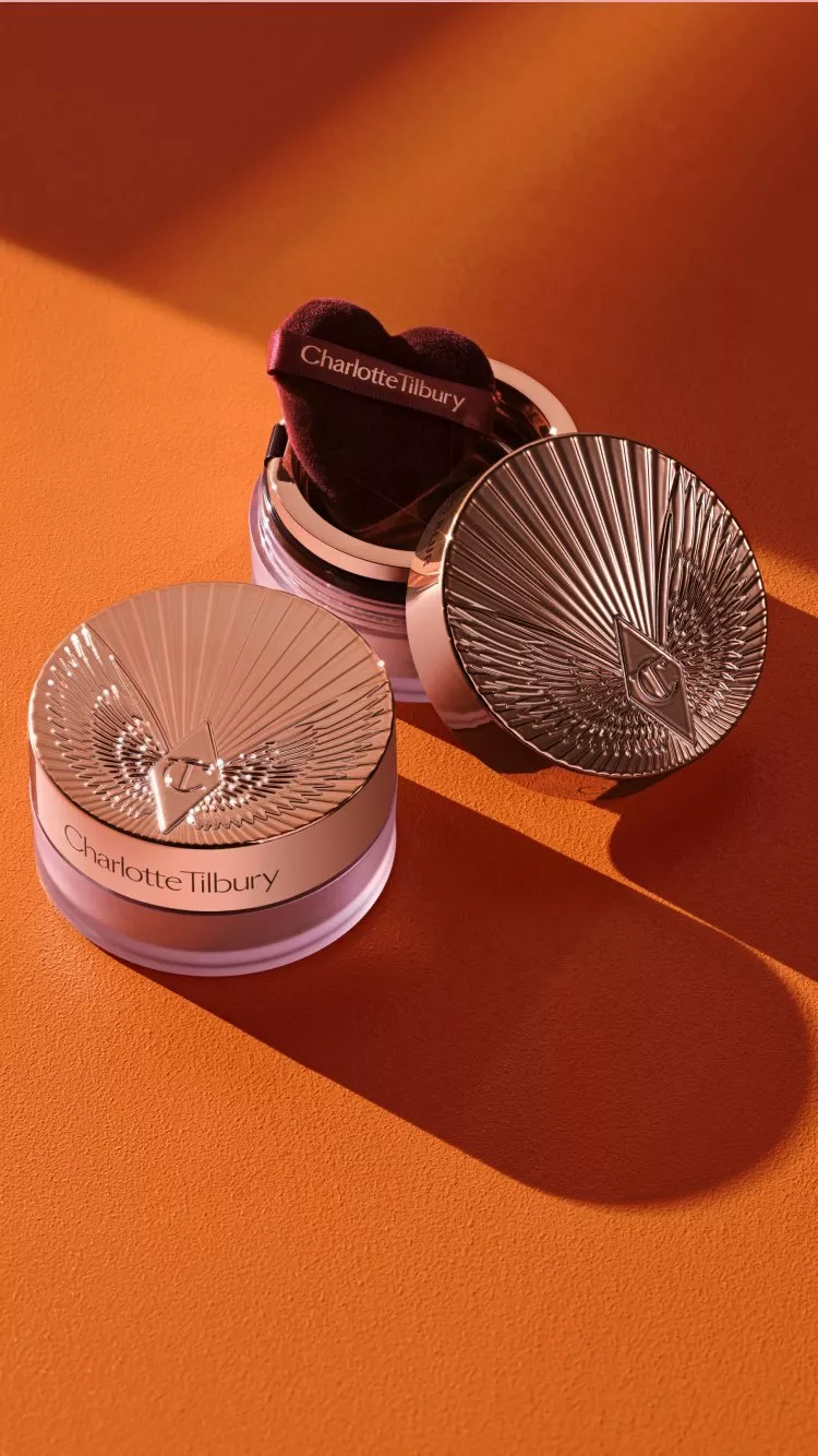 charlotte ilbury products on a orange table