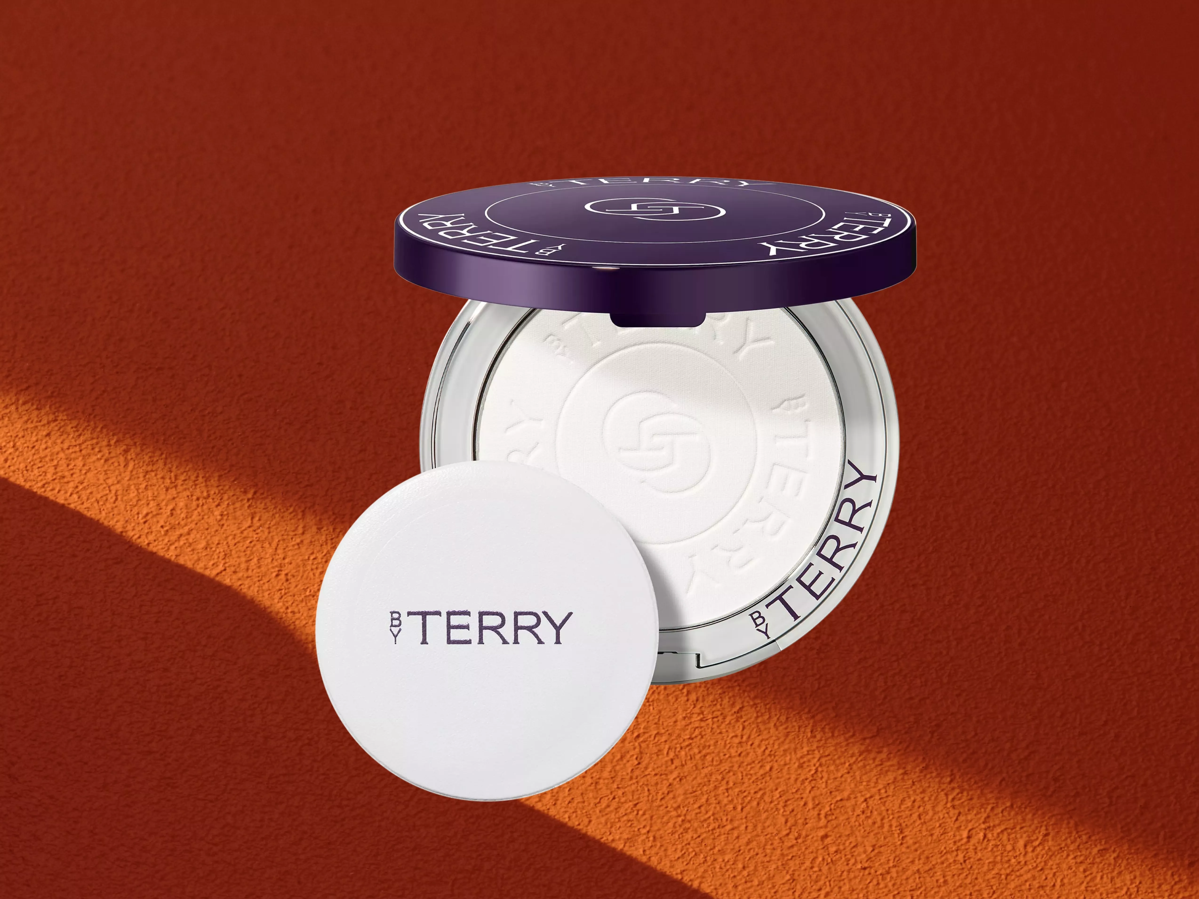BY TERRY 8HA Hyaluronic Pressed Hydra-Powder on a orange background