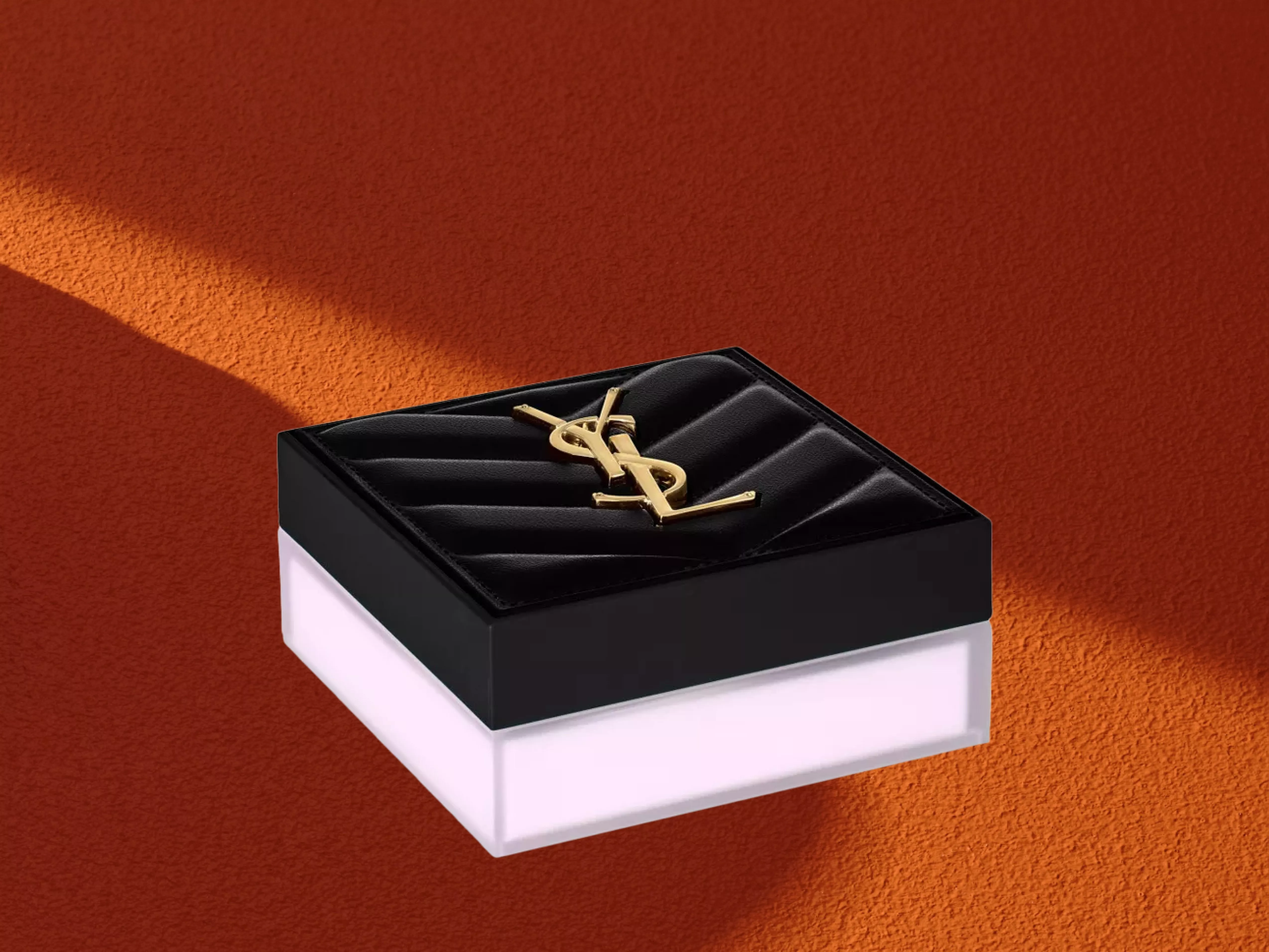 Yves Saint Laurent All Hours Hyper Blur Loose Powder on a orange background